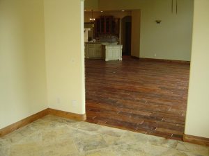 This picture shows the wood and tile flooring in a custom home.