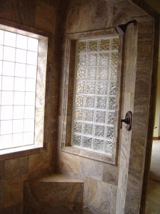 this is the custom tile shower with glass block windows in a custom home.