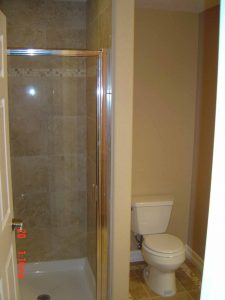Here is a basement finish bathroom shower and toilet.