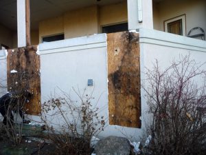 This shows exposed water damage on the exterior of a house.