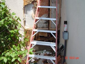 This is an image of an exterior wall with water damage.