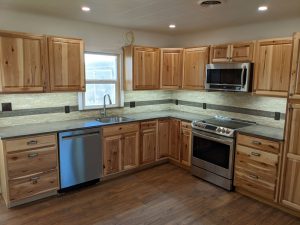 Shown here is a kitchen remodel with beautiful wood cabinets.