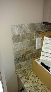 This image is a close-up of custom kitchen tile work.