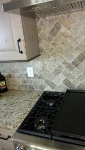 This image is a close-up of custom kitchen tile work.