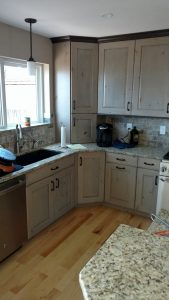 This is a complete kitchen remodel with cabinets, floors and tile work.
