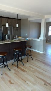 This is a complete kitchen remodel with cabinets, floors and tile work.
