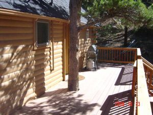 This is the exterior and deck of a full cabin remodel.