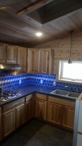 Shown here is the kitchen inside a custom cabin.