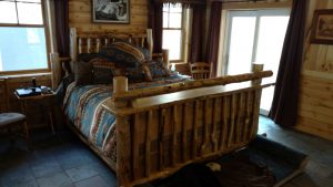 This is the bedroom inside a custom cabin.
