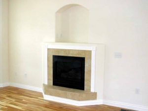 In this picture is a fireplace in a custom home.