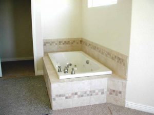 This is a jetted tub in a custom built home.