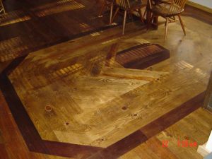Shown here is a custom wood floor with inlaid design.